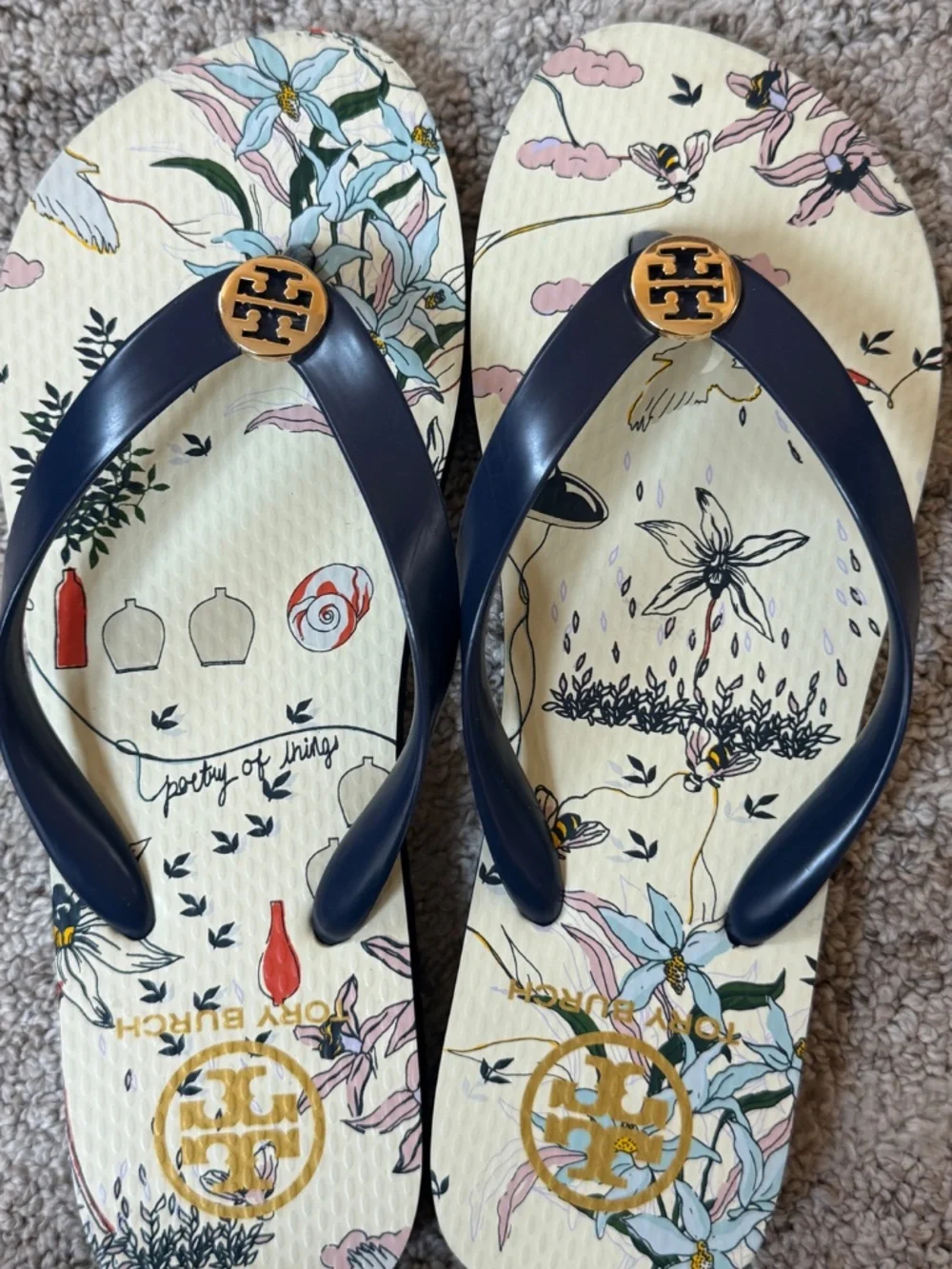 Tory Burch navy “poetry of things” flip flops, size 7 1/2